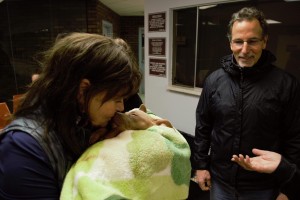 Christine Tortorella and husband, John, comfort a puppy after being spayed as she comes of sedation.