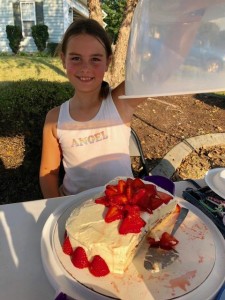 Jordan made this strawberry filled and decorated cake as part of her sale.