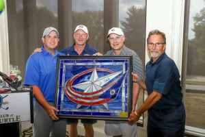 Foursome George Choposky, Jarmo Kekalainen, Anthony Rothman and John Tortorella with stained glass logo for auction